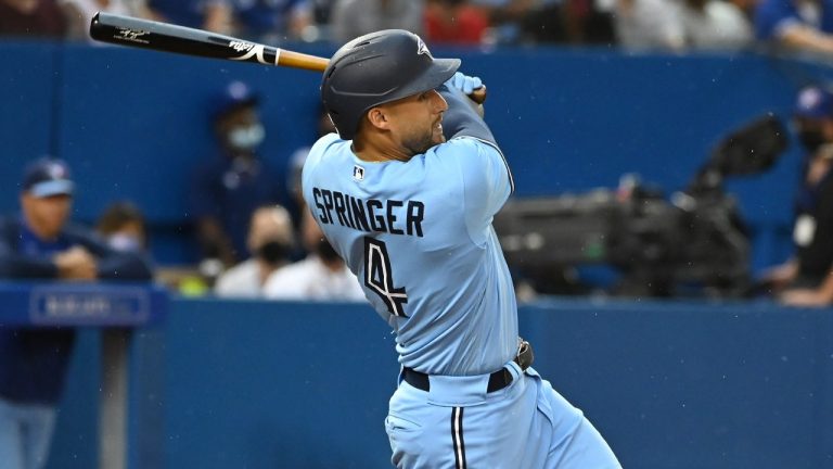 Toronto Blue Jays’ George Springer hits a two-run home run against the Kansas City Royals during third inning MLB baseball action in Toronto on Saturday, July 31, 2021. (Jon Blacker/CP)