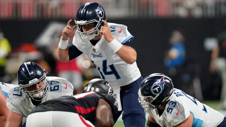 Tennessee Titans quarterback Matt Barkley, top, works against the Atlanta Falcons during the second half of a preseason NFL football game. (Brynn Anderson/AP) 