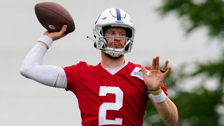 Indianapolis Colts quarterback Carson Wentz runs a drill during practice at the NFL team's football training camp in Westfield, Ind., Wednesday, July 28, 2021. (Michael Conroy/AP)