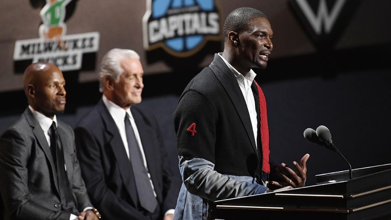 Inductee Chris Bosh, right, speaks as Ray Allen, left, and Pat Riley listen during the 2021 Basketball Hall of Fame Enshrinement ceremony, Saturday, Sept. 11, 2021, in Springfield, Mass. (Jessica Hill/AP)