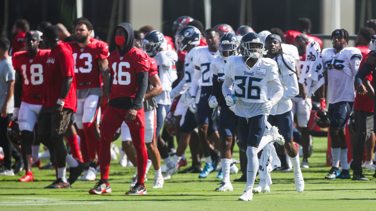 Tampa Bay Buccaneers players on the field along with Tennessee Titans players during a joint NFL football practice at Bucs training camp at the AdventHealth Training Center on Wednesday, Aug. 18, 2021 in Tampa. (Dirk Shadd/Tampa Bay Times via AP) 