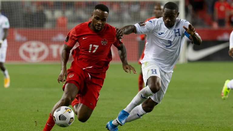 Canada's Cyle Larin (left) takes on Honduras' Maynor Figueroa during second half World Cup qualifying action in Toronto on Thursday, September 2, 2021. (Chris Young/CP)