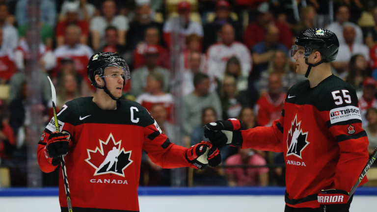 Canada's Connor McDavid, left, celebrates a goal with teammate Colton Parayko, right, during the Ice Hockey World Championships group B match between Canada and Denmark at the Jyske Bank Boxen arena in Herning, Denmark, Monday, May 7, 2018. (Petr David Josek / AP) 