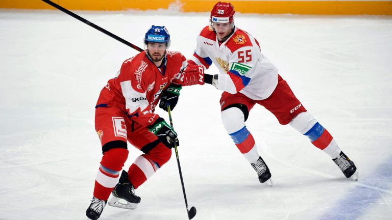 Michael Spacek of Czech Republic, left, and Daniil Chayka of Russia in action during the EHT ice hockey Karjala Cup match, (Vesa Moilanen/AP)