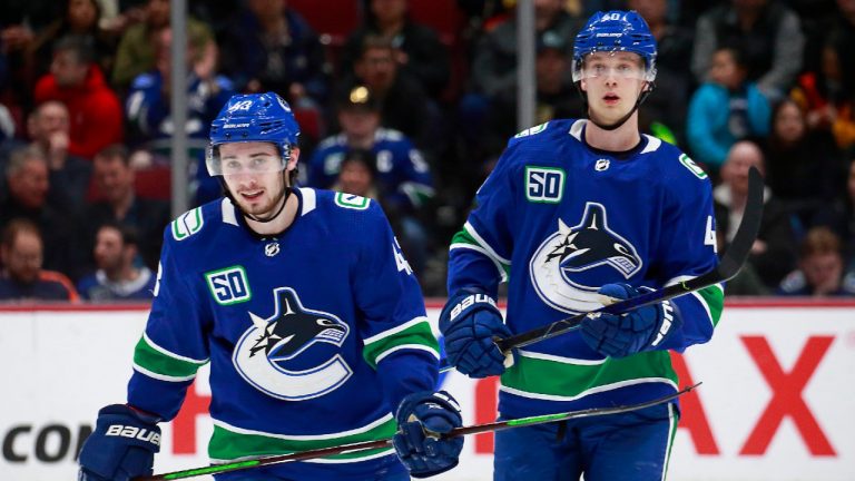 Quinn Hughes and Elias Pettersson of the Vancouver Canucks. (Jeff Vinnick/NHLI via Getty Images)