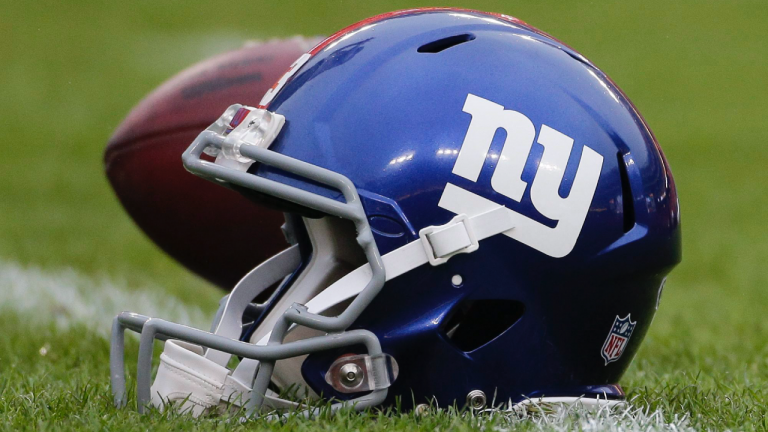 n this Nov. 29, 2015 file photo, a New York Giants helmet sits on the field before an NFL football game against the Washington Redskins in Landover, Md. (Mark Tenally / AP)