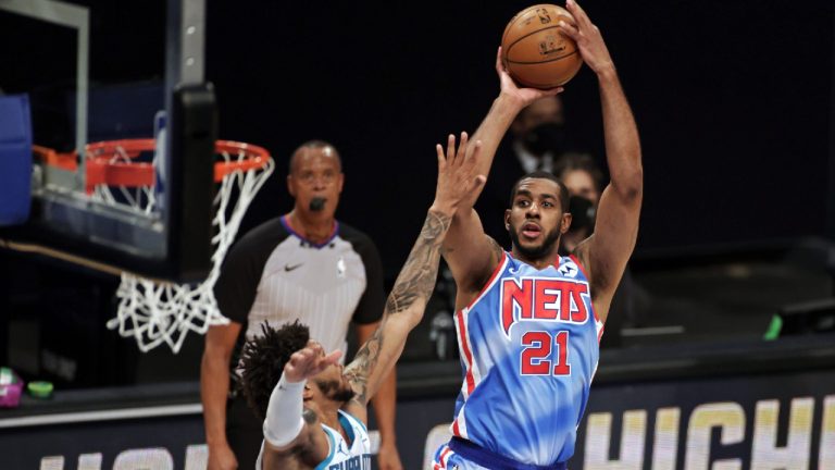 Brooklyn Nets center LaMarcus Aldridge shoots over Charlotte Hornets forward Miles Bridges during the first half of an NBA basketball game. (Adam Hunger/AP)