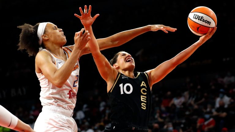 Las Vegas Aces guard Kelsey Plum (10) lays up the ball as Phoenix Mercury forward Brianna Turner (21) defends during the second half of Game 1 in the semifinals of the WNBA playoffs Tuesday, Sept. 28, 2021, in Las Vegas. The Aces beat the Mercury 96-90. (Steve Marcus/AP)