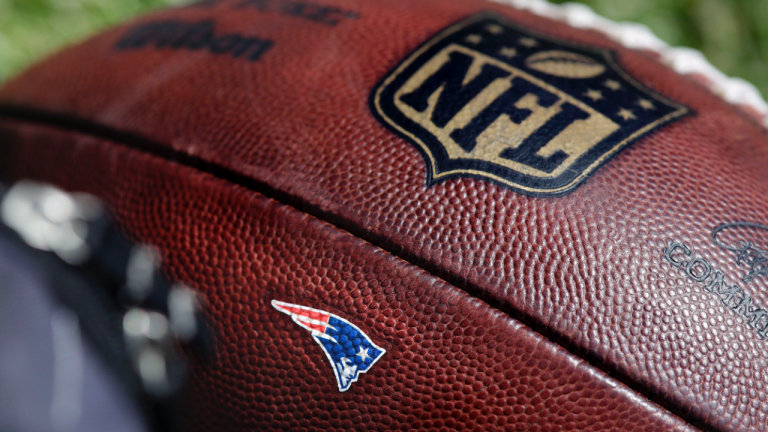 The New England Patriots logo adorns a football during practice at the NFL football team's training camp in Foxborough, Mass., Thursday, May 31, 2018. (Charles Krupa / AP) 