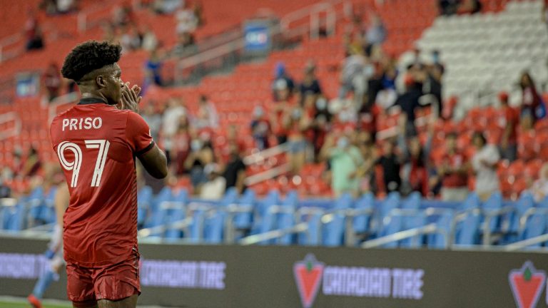 Toronto FC midfielder Ralph Priso (97) greets the crowd after full time MLS soccer action against New York City in Toronto on Saturday, August 7, 2021. Second-half goals by Richie Laryea and Alejandro Pozuelo lifted Toronto FC into a wild 2-2 tie with New York City FC in MLS play Saturday (Chris Katsarov/CP).