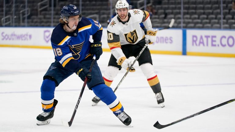 St. Louis Blues' Robert Thomas (18) looks for a shot as Vegas Golden Knights' Nicolas Roy (10) defends during the second period of an NHL hockey game Wednesday, April 7, 2021, in St. Louis. (Jeff Roberson/AP)