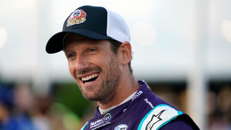 Romain Grosjean (51) smiles before the start an IndyCar auto race at World Wide Technology Raceway on Saturday, Aug. 21, 2021, in Madison, Ill (Jeff Roberson/AP).