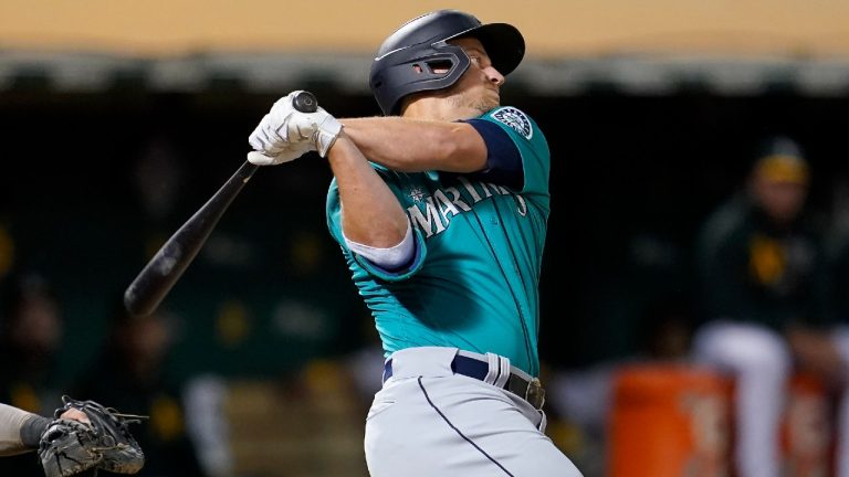 Seattle Mariners' Kyle Seager hits a two-run double against the Oakland Athletics during the third inning of a baseball game in Oakland, Calif., Monday, Sept. 20, 2021. (Jeff Chiu/AP)