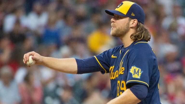 Milwaukee Brewers starting pitcher Corbin Burnes stretches between batters during the fifth inning of a baseball game against the Cleveland Indians in Cleveland, Saturday, Sept. 11, 2021. (Phil Long/AP) 
