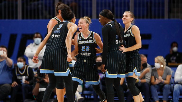 Chicago Sky guard Courtney Vandersloot (22) celebrates with teammates after scoring against the Dallas Wings during the second half in the first round of the WNBA basketball playoffs, Thursday, Sept. 23, 2021, in Chicago. (AP Photo/Kamil Krzaczynski) 
