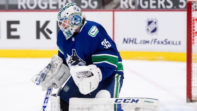 Vancouver Canucks goalie Thatcher Demko watches the puck after making a blocker save during the first period of an NHL hockey game against the Winnipeg Jets, in Vancouver, B.C., Monday, March 22, 2021. (Darryl Dyck/CP)