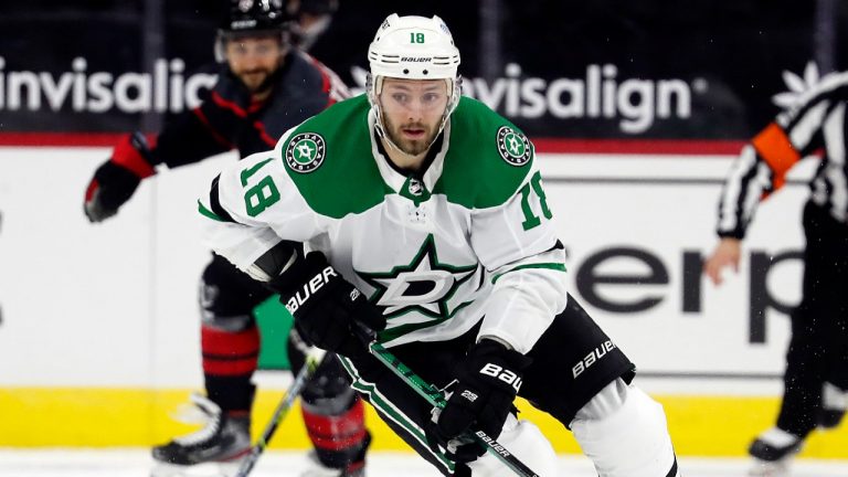 Dallas Stars' Jason Dickinson (18) brings the puck up the ice against the Carolina Hurricanes during the third period of an NHL hockey game in Raleigh, N.C., Saturday, Jan. 30, 2021. (Karl B DeBlaker/AP)