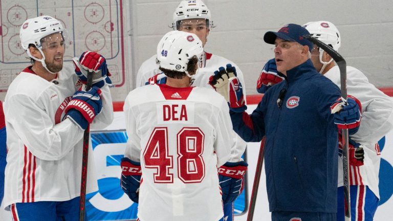 Montreal Canadiens head coach Domenic Ducharme speaks to Chris Wideman, left Joshua Roy, and Jean-Sebastien Dea during the first day of on ice training camp Thursday, September 23, 2021 in Brossard, Quebec. (Ryan Remiorx/THE CANADIAN PRESS)