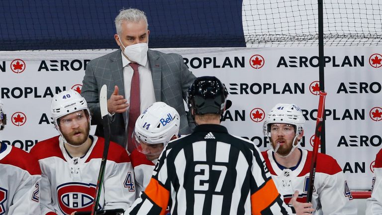 Montreal Canadiens head coach Dominique Ducharme talks to a referee during second period NHL action against the Winnipeg Jets in Winnipeg on Saturday, February 27, 2021. (John Woods/CP)