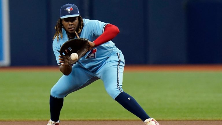 Toronto Blue Jays first baseman Vladimir Guerrero Jr. fields a ground ball by Tampa Bay Rays' Brandon Lowe during the first inning of a baseball game Wednesday, Sept. 22, 2021, in St. Petersburg, Fla. Lowe was out at first. (Chris O'Meara/AP)