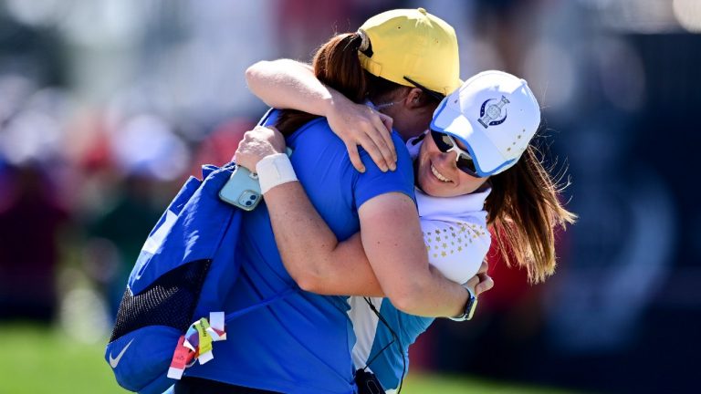 Europe's Leona Maguire celebrates with her sister Lisa after defeating United States' Jennifer Kupcho on the 15th hole during the singles matches at the Solheim Cup golf tournament, Monday, Sept. 6, 2021, in Toledo, Ohio. (David Dermer/AP)