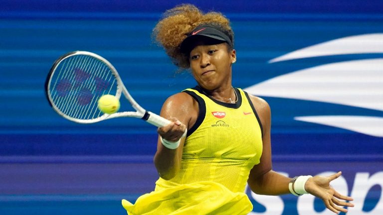 Naomi Osaka, of Japan, returns a shot to Marie Bouzkova, of the Czech Republic, during the first round of the US Open tennis championships, Monday, Aug. 30, 2021, in New York. (Elise Amendola/AP)