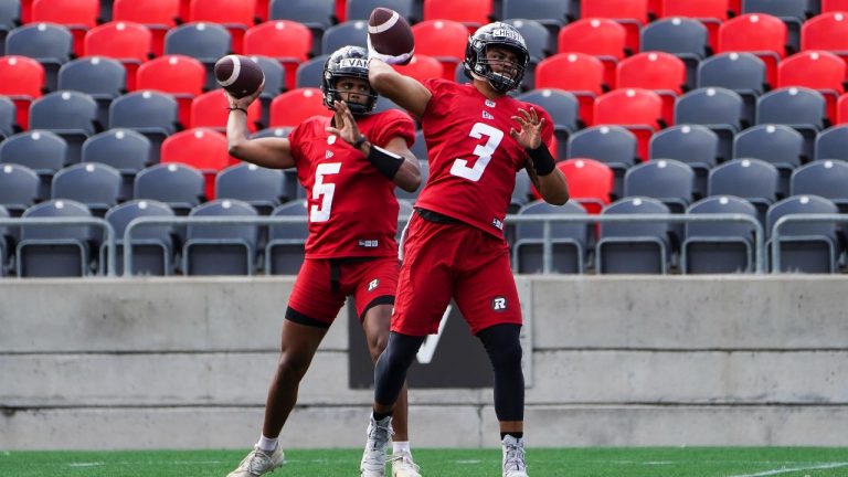 Redblacks quarterbacks Caleb Evans, left, and Taryn Christion take part in a CFL training camp in Ottawa on Wednesday, July 14, 2021. (Sean Kilpatrick/THE CANADIAN PRESS) 