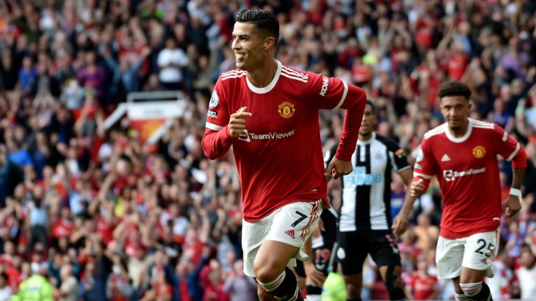 Manchester United's Cristiano Ronaldo celebrates after scoring the opening goal during the English Premier League soccer match between Manchester United and Newcastle United at Old Trafford stadium in Manchester, England, Saturday, Sept. 11, 2021. (Rui Vieira/AP)