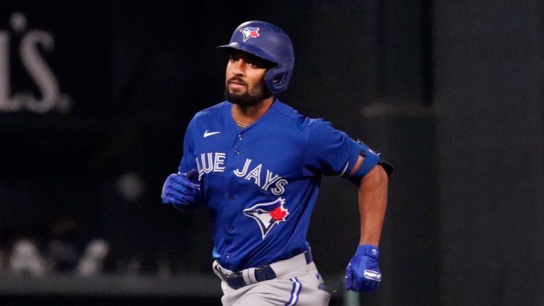 Toronto Blue Jays' Marcus Semien rounds the bases on his solo home run off Minnesota Twins pitcher Bailey Ober in the sixth inning of a baseball game, Friday, Sept. 24, 2021, in Minneapolis. (Jim Mone/AP)