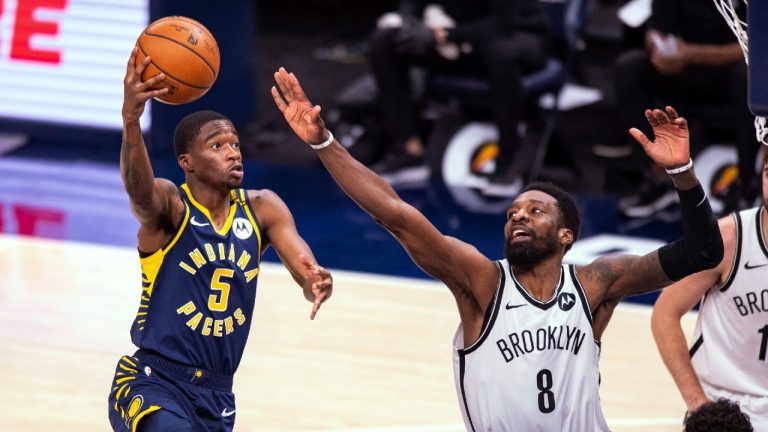 Indiana Pacers guard Edmond Sumner (5) shoots around the defense of Brooklyn Nets forward Jeff Green (8) during the second half of an NBA basketball game in Indianapolis, Thursday, April 29, 2021. (Doug McSchooler/AP)