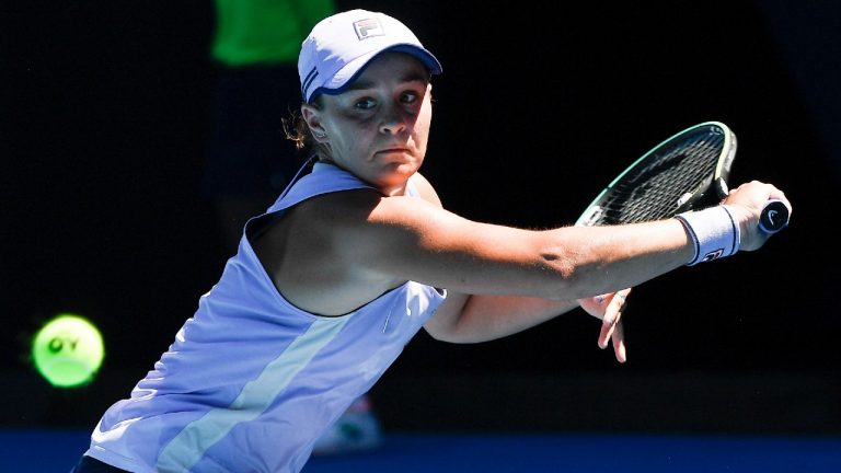 Australia's Ash Barty hits a backhand return to Karolina Muchova of the Czech Republic during their quarterfinal match at the Australian Open tennis championship in Melbourne, Australia, Wednesday, Feb. 17, 2021 (Andy Brownbill/AP).