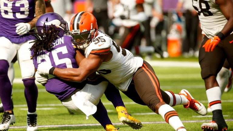 Minnesota Vikings running back Alexander Mattison (25) is tackled by Cleveland Browns defensive end Myles Garrett (95) during the second half of an NFL football game, Sunday, Oct. 3, 2021, in Minneapolis. (Bruce Kluckhohn/AP Photo) 
