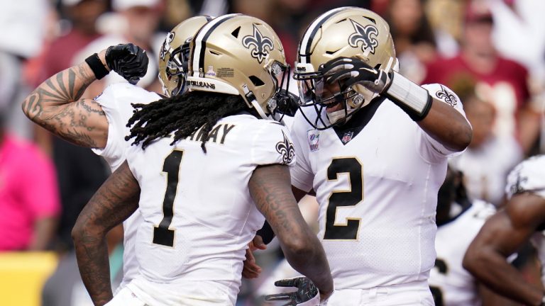 New Orleans Saints wide receiver Marquez Callaway (1) celebrates with quarterback Jameis Winston (2) after catching a Hail Mary pass for a touchdown in the first half of an NFL football game against the Washington Football Team, Sunday, Oct. 10, 2021, in Landover, Md. (Julio Cortez/AP) 