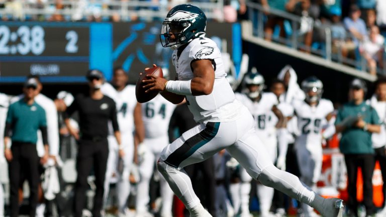 Philadelphia Eagles quarterback Jalen Hurts runs for a touchdown against the Carolina Panthers during the second half of an NFL football game Sunday, Oct. 10, 2021, in Charlotte, N.C. (Nell Redmond/AP) 