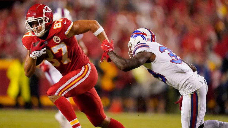 Kansas City Chiefs tight end Travis Kelce, left, catches a pass as Buffalo Bills cornerback Siran Neal defends during the first half of an NFL football game Sunday, Oct. 10, 2021, in Kansas City, Mo. (Charlie Riedel/AP)