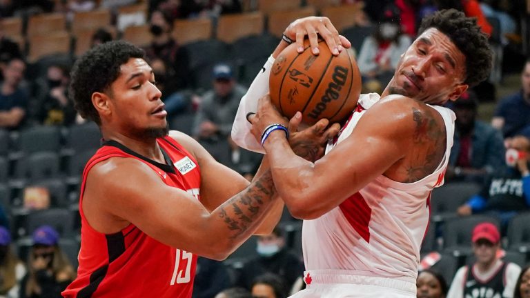 Houston Rockets guard Daishen Nix (15) and Toronto Raptors forward Ishmail Wainright (12) grapple for the ball during second half NBA preseason basketball action in Toronto on Monday, Oct. 11, 2021. (Evan Buhler /CP)