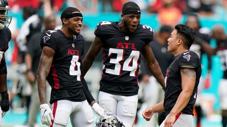 Atlanta Falcons wide receiver Tajae Sharpe (4) and cornerback Darren Hall (34) congratulate kicker Younghoe Koo (7) after he kicked the game-winning field goal during the second half of an NFL football game against the Miami Dolphins, Sunday, Oct. 24, 2021, in Miami Gardens, Fla. The Falcons defeated the Dolphins 30-28. (Wilfredo Lee/AP)