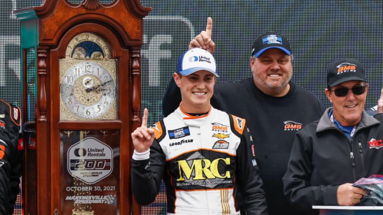 Zane Smith celebrates with teammates after winning the NASCAR Truck Series race on Saturday. (AP)