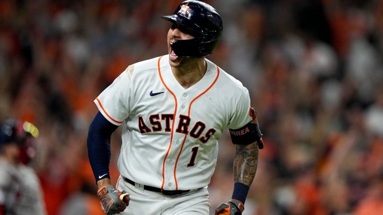 Houston Astros shortstop Carlos Correa celebrates a home run against the Boston Red Sox during the seventh inning in Game 1 of the 2021 ALCS. (David J. Phillip/AP).