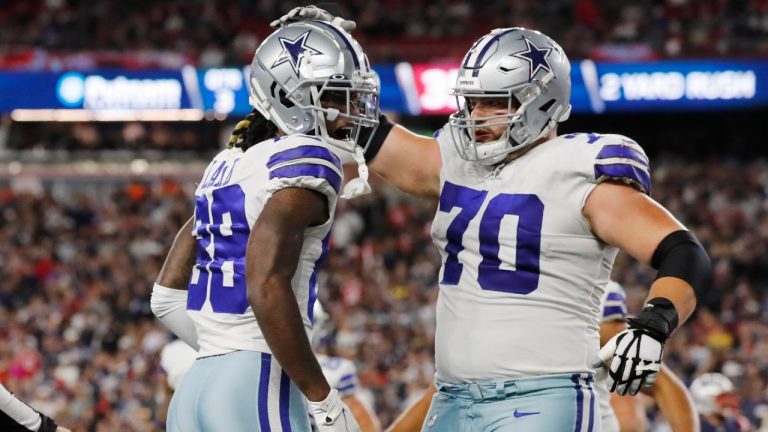 Dallas Cowboys wide receiver CeeDee Lamb (88) is congratulated by guard Zack Martin (70) after his touchdown during the second half of an NFL football game against the New England Patriots, Sunday, Oct. 17, 2021, in Foxborough, Mass. (Michael Dwyer/AP)