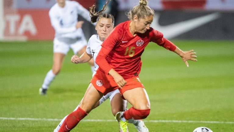 Canada’s Janine Beckie, right, breaks away from New Zealand’s Olivia Chance during first half Celebration Tour soccer action in Montreal, Tuesday, October 26, 2021 (Graham Hughes/CP).