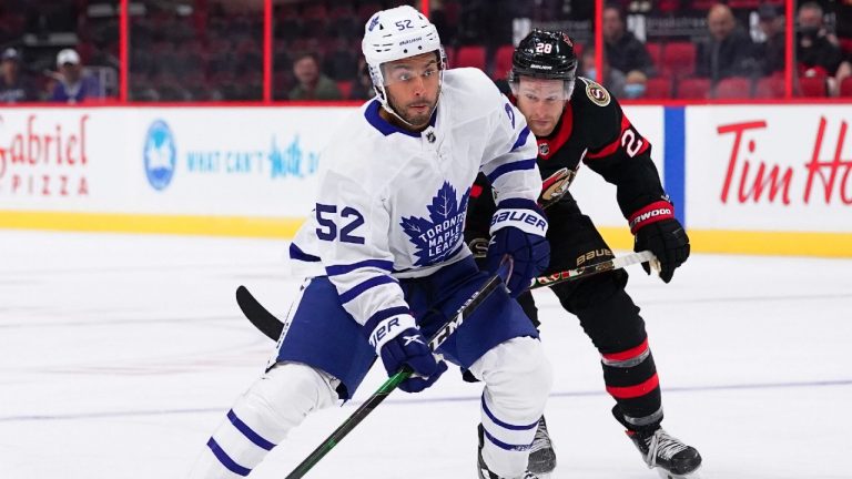 Toronto Maple Leafs forward Josh Ho-Sang (52) carries the puck as Ottawa Senators right wing Connor Brown (28) defends during first period pre-season NHL action in Ottawa on Wednesday, Sept. 29, 2021 (Sean Kilpatrick/CP).