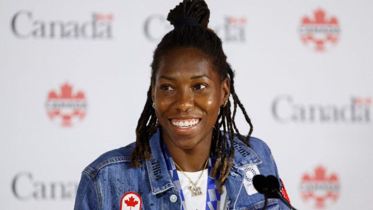 Canadian soccer team's Kadeisha Buchanan smiles at a press conference at BMO Field in Toronto on Aug. 10, 2021 (Cole Burston/CP).