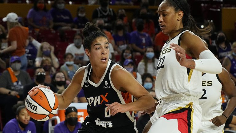 Phoenix Mercury guard Kia Nurse (0) drives on Las Vegas Aces forward A'ja Wilson during the first half of a WNBA basketball game Sunday, Oct. 3, 2021, in Phoenix. (Rick Scuteri/AP)