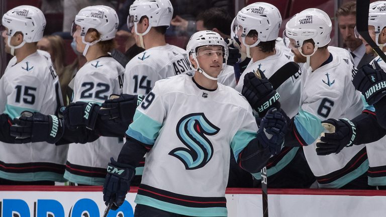 Seattle Kraken's Vince Dunn (29) celebrates his first goal against the Vancouver Canucks during the second period of a pre-season NHL hockey game. (Darryl Dyck/CP)