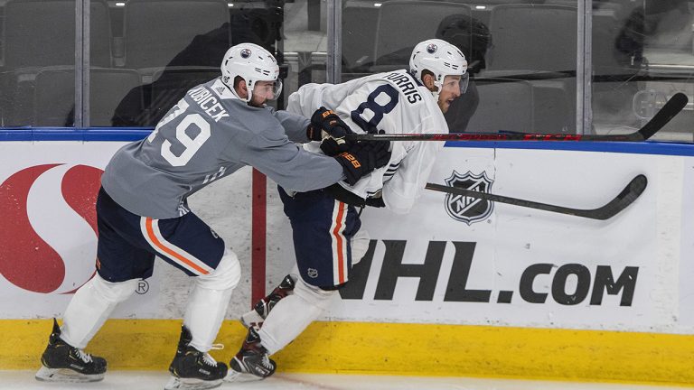 Edmonton Oilers' Simon Kubicek (79) check Kyle Turris (8) during training camp in Edmonton, Alta., on Friday September 24, 2021. (Jason Franson/CP)