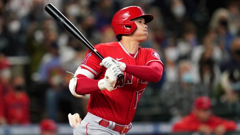 Los Angeles Angels' Shohei Ohtani watches the path of his solo home run against the Seattle Mariners in the first inning of a baseball game Sunday, Oct. 3, 2021, in Seattle. (Elaine Thompson/AP)