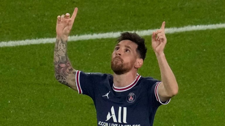 PSG's Lionel Messi celebrates after scoring his side's third goal during his Champions League soccer match between Paris Saint Germain and RB Leipzig at the Parc des Princes stadium in Paris, Tuesday, Oct. 19, 2021. (Christophe Ena/AP Photo) 
