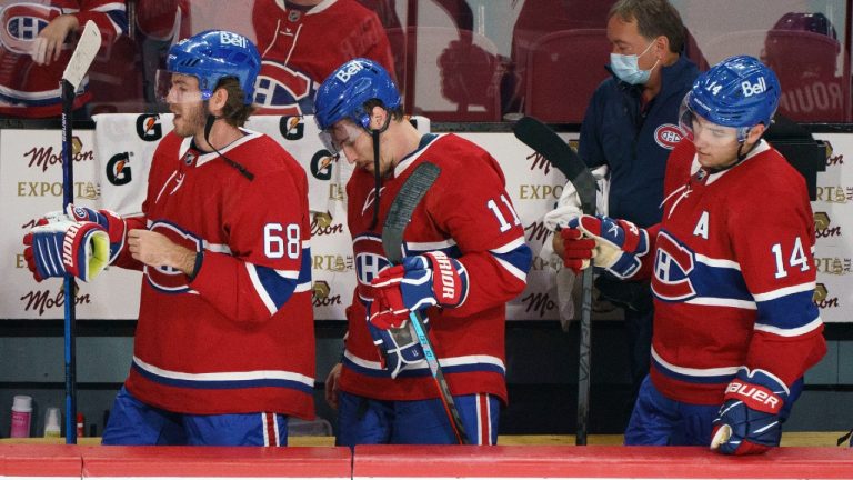 Montreal Canadiens' Mike Hoffman, Brendan Gallagher and Nick Suzuki, left to right, walk off the bench following their loss to the Carolina Hurricanes in NHL hockey action in Montreal on Thursday, October 21, 2021 (Paul Chiasson/CP).