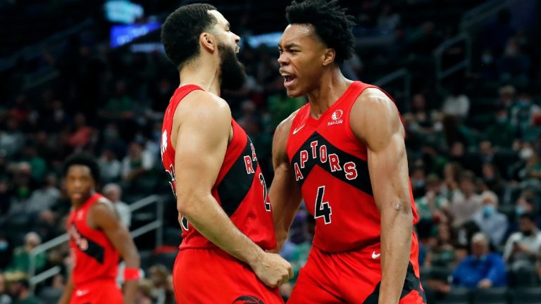 Toronto Raptors' Scottie Barnes (4) reacts with teammate Fred VanVleet after scoring during the second half of an NBA basketball game against the Boston Celtics, Friday, Oct. 22, 2021, in Boston (Michael Dwyer/AP).